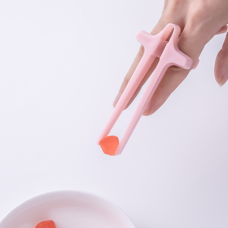 A pair of colorful Free-Hands Snack Chopsticks designed for hands-free snacking, showcasing their unique finger holes and durable plastic material.