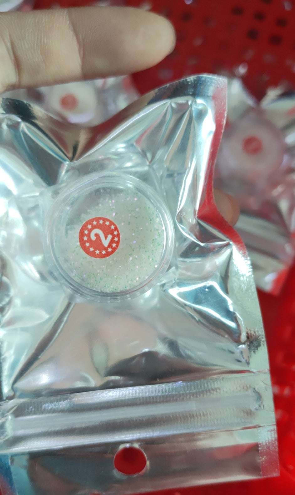 A pair of colorful Free-Hands Snack Chopsticks designed for hands-free snacking, showcasing their unique finger holes and durable plastic material.