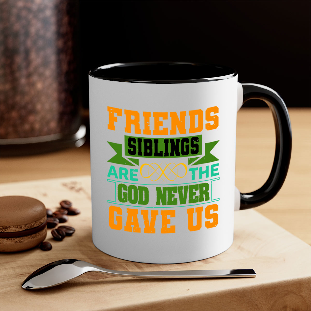 Ceramic mug with a two-tone design featuring a colored handle and interior, displaying the phrase 'Friends are the siblings God never gave us'.
