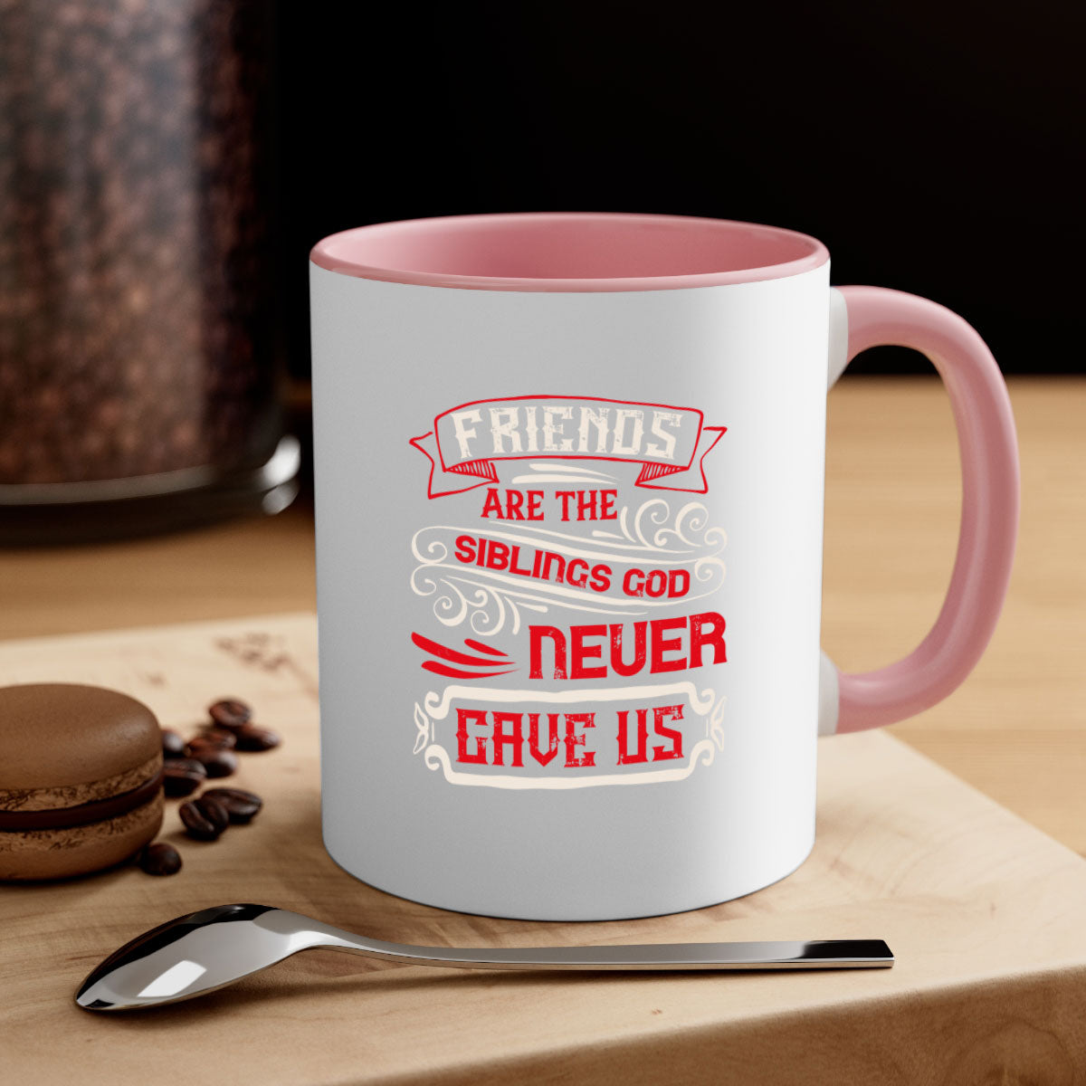 Two-tone ceramic mug with colored handle and interior, featuring the phrase 'Friends are the siblings God never gave us' in a glossy finish.
