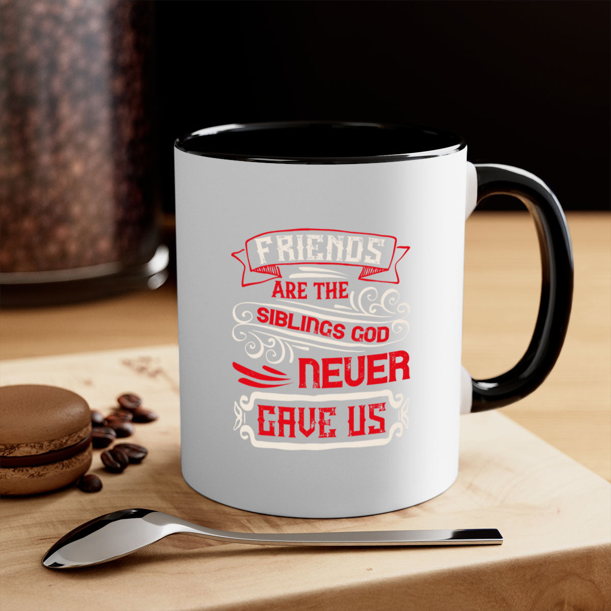 Two-tone ceramic mug with colored handle and interior, featuring the phrase 'Friends are the siblings God never gave us' in a glossy finish.