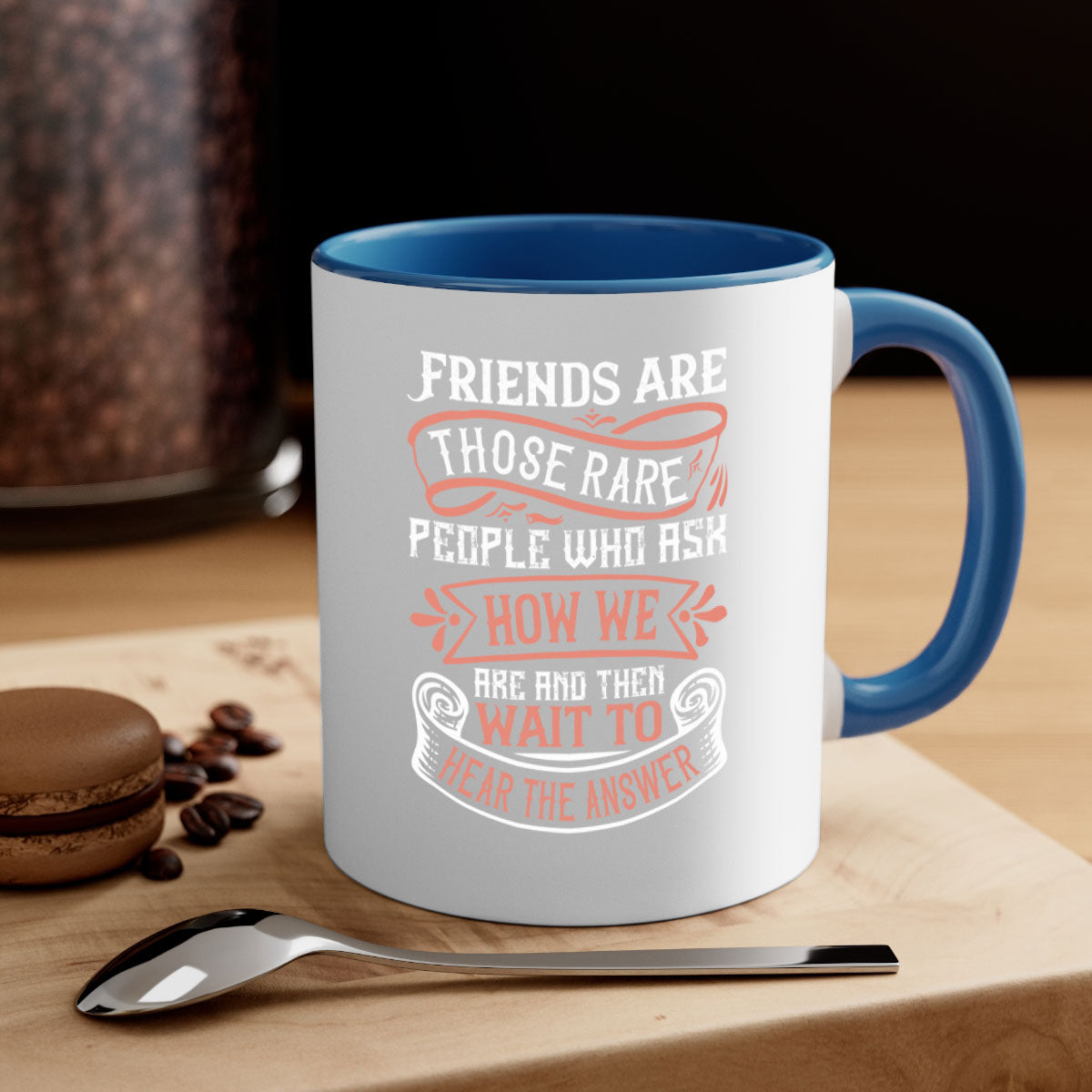 Two-tone ceramic mug with a colored handle and interior, featuring a quote about friendship.
