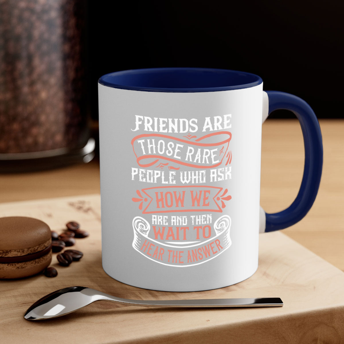Two-tone ceramic mug with a colored handle and interior, featuring a quote about friendship.