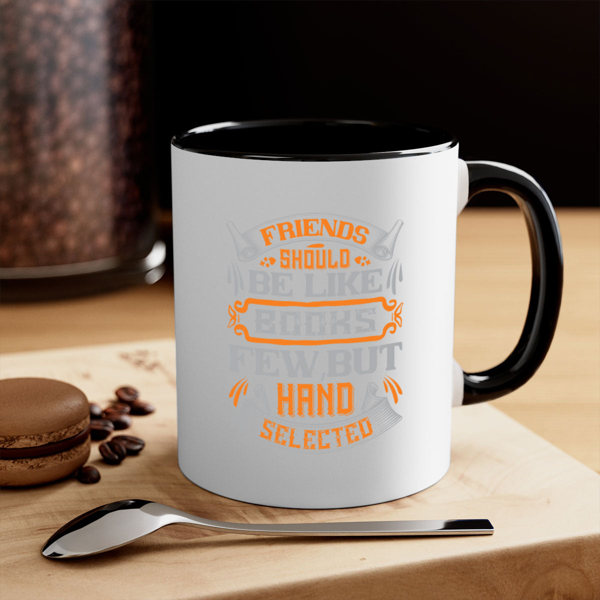 A stylish two-tone ceramic mug with a colored handle and interior, featuring the phrase 'Friends should be like books few but hand selected'.