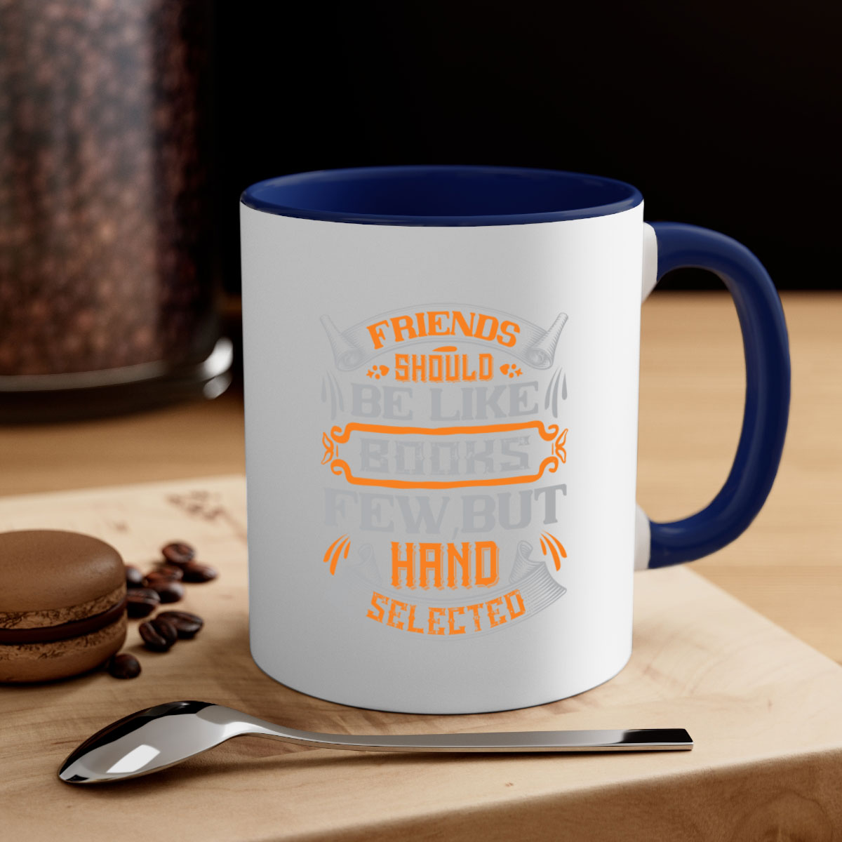 A stylish two-tone ceramic mug with a colored handle and interior, featuring the phrase 'Friends should be like books few but hand selected'.