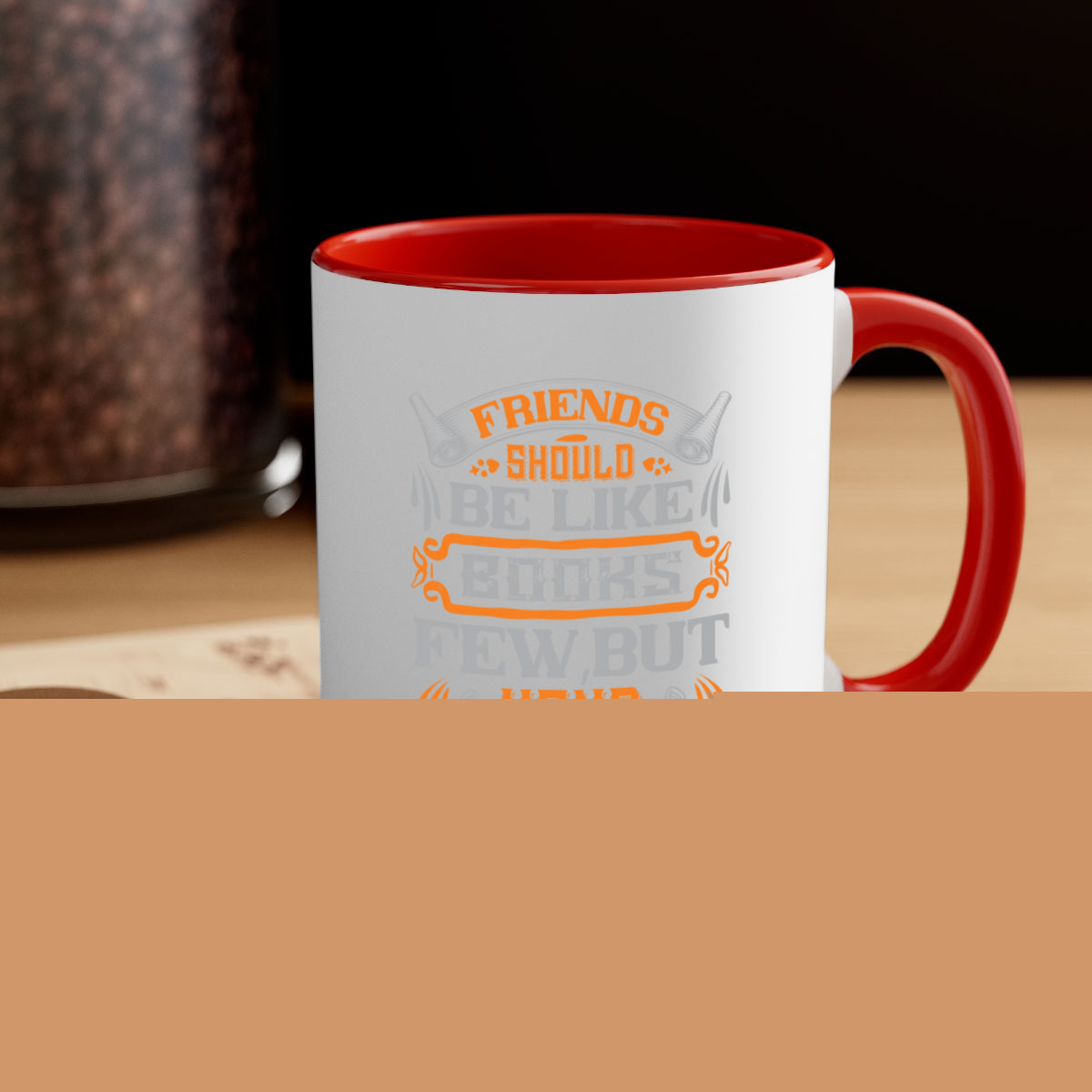 A stylish two-tone ceramic mug with a colored handle and interior, featuring the phrase 'Friends should be like books few but hand selected'.