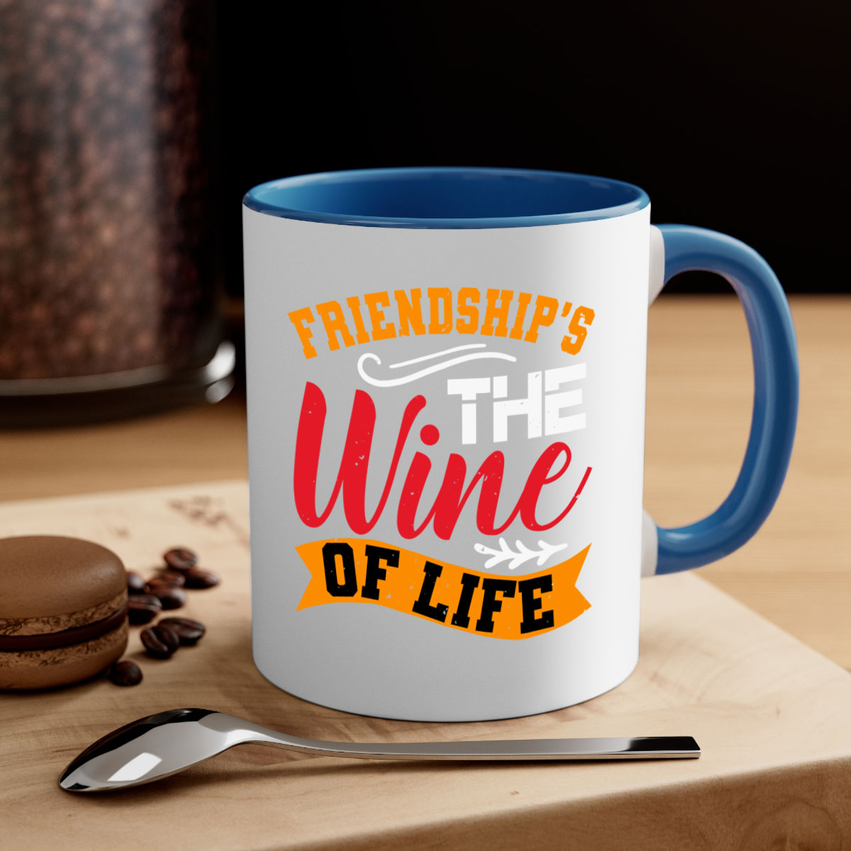 Two-tone ceramic mug with colored handle and glossy finish, featuring the phrase 'Friendship’s the wine of life'.