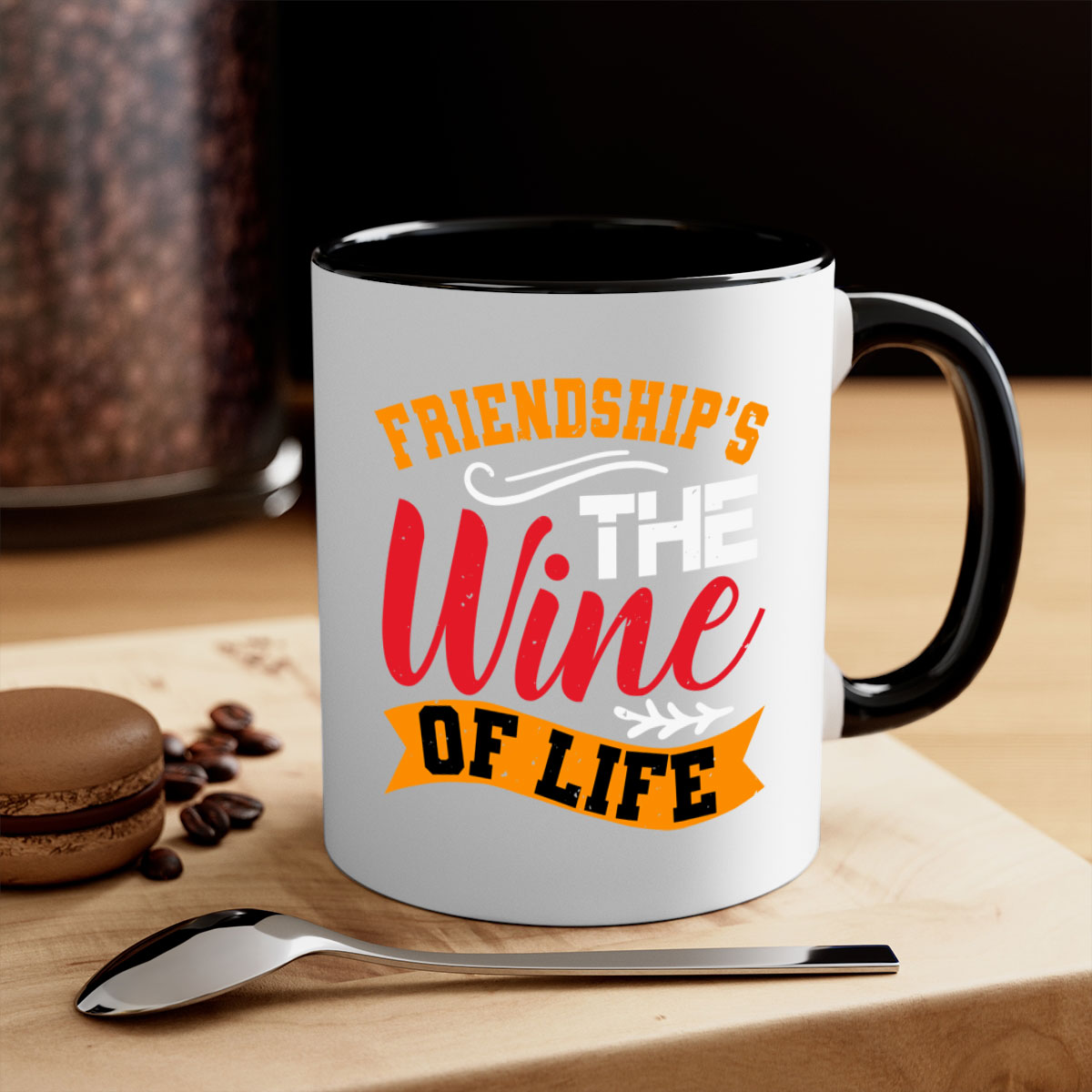 Two-tone ceramic mug with colored handle and glossy finish, featuring the phrase 'Friendship’s the wine of life'.