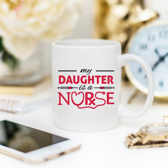 Funny Nurse Mug featuring the text 'My Daughter Is A Nurse', perfect for coffee lovers.