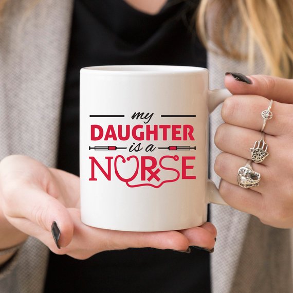 Funny Nurse Mug featuring the text 'My Daughter Is A Nurse', perfect for coffee lovers.