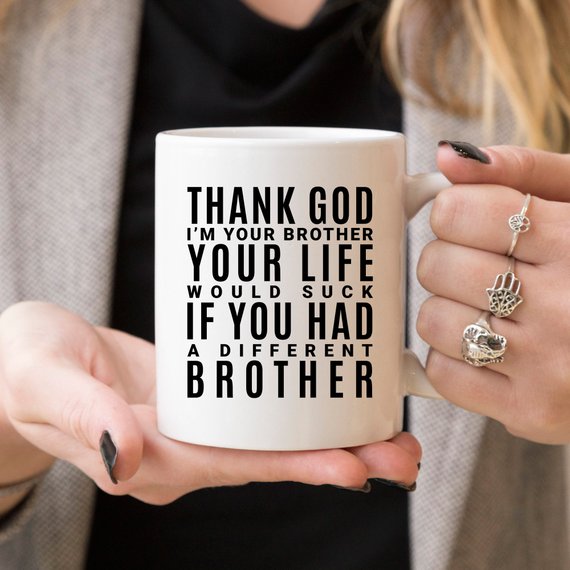 A white ceramic mug featuring a humorous design for sisters, printed on both sides, showcasing vibrant colors.