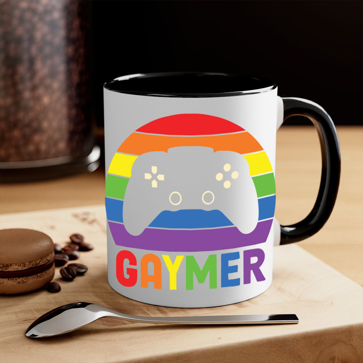 A vibrant gaymer LGBT gamer mug featuring a rainbow flag design with a glossy finish and a colored handle.
