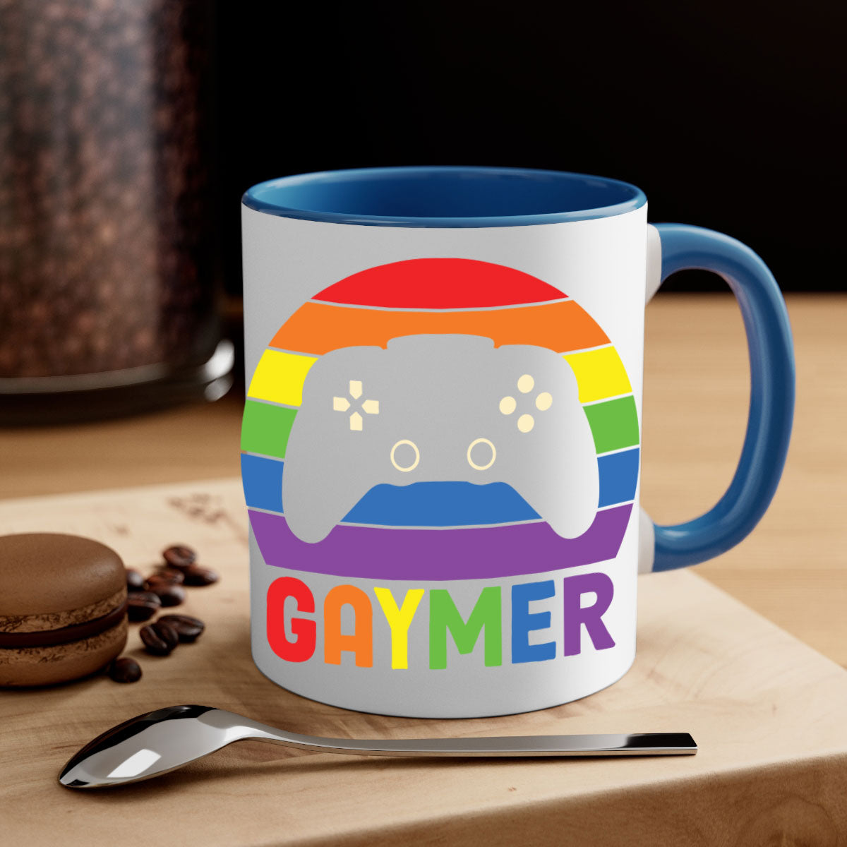 A vibrant gaymer LGBT gamer mug featuring a rainbow flag design with a glossy finish and a colored handle.