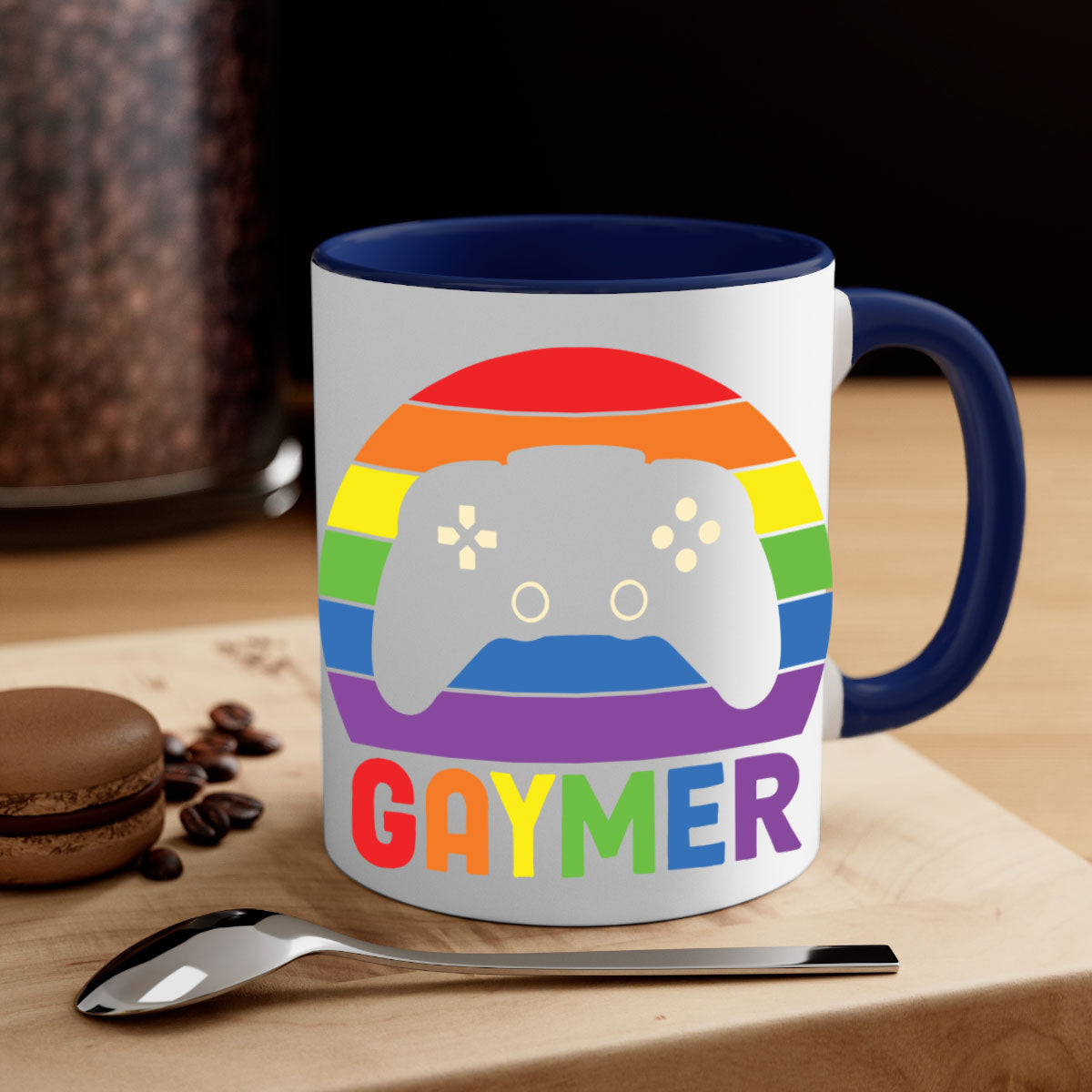 A vibrant gaymer LGBT gamer mug featuring a rainbow flag design with a glossy finish and a colored handle.