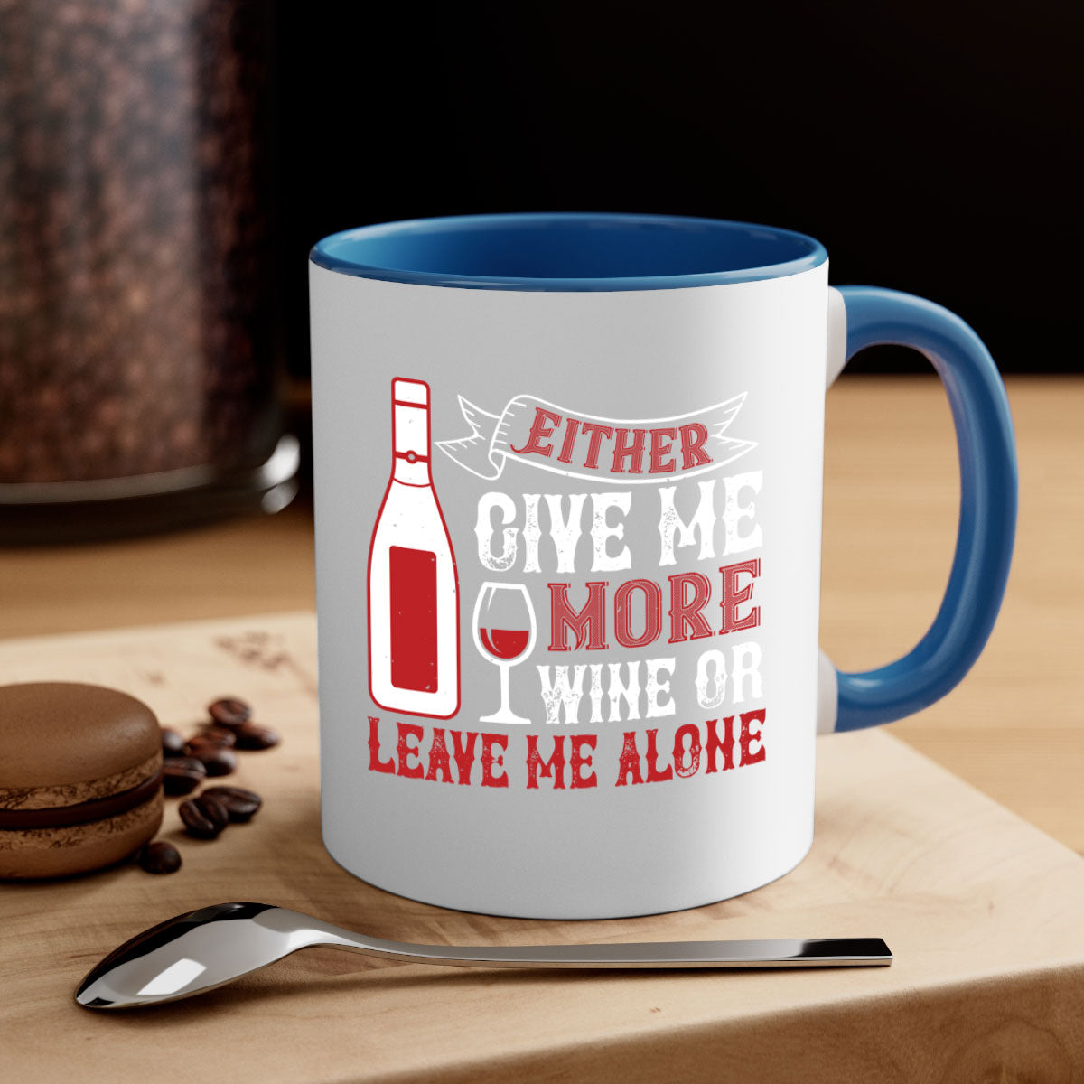 Ceramic coffee mug with a glossy finish featuring the phrase 'Give Me More Wine or Leave Me Alone' in a stylish font, available in multiple colors.
