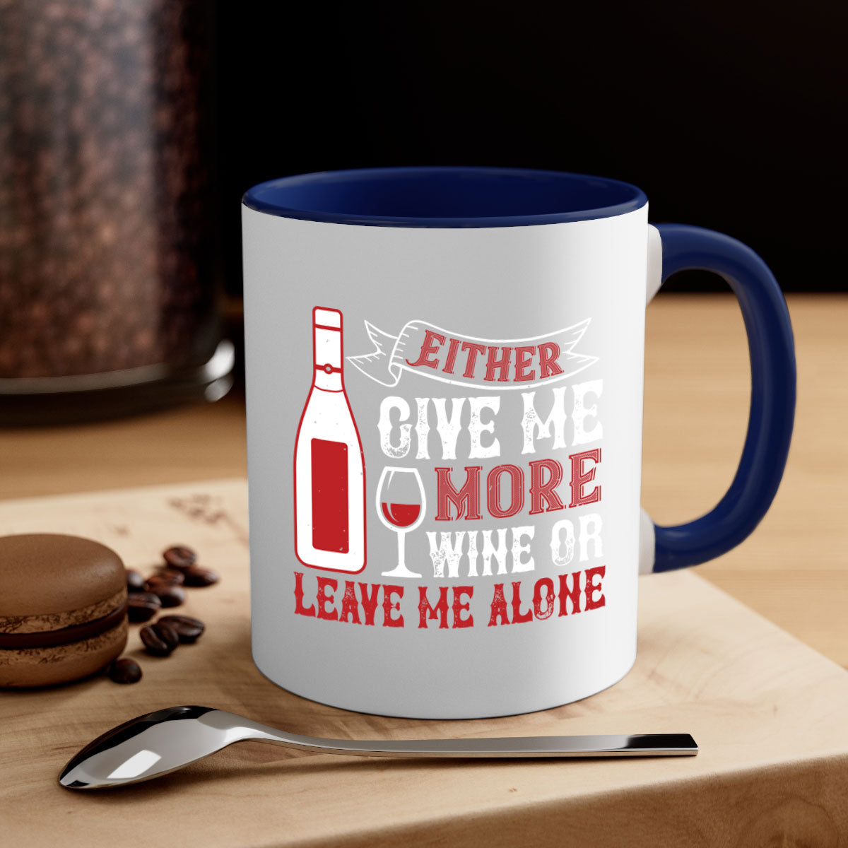 Ceramic coffee mug with a glossy finish featuring the phrase 'Give Me More Wine or Leave Me Alone' in a stylish font, available in multiple colors.
