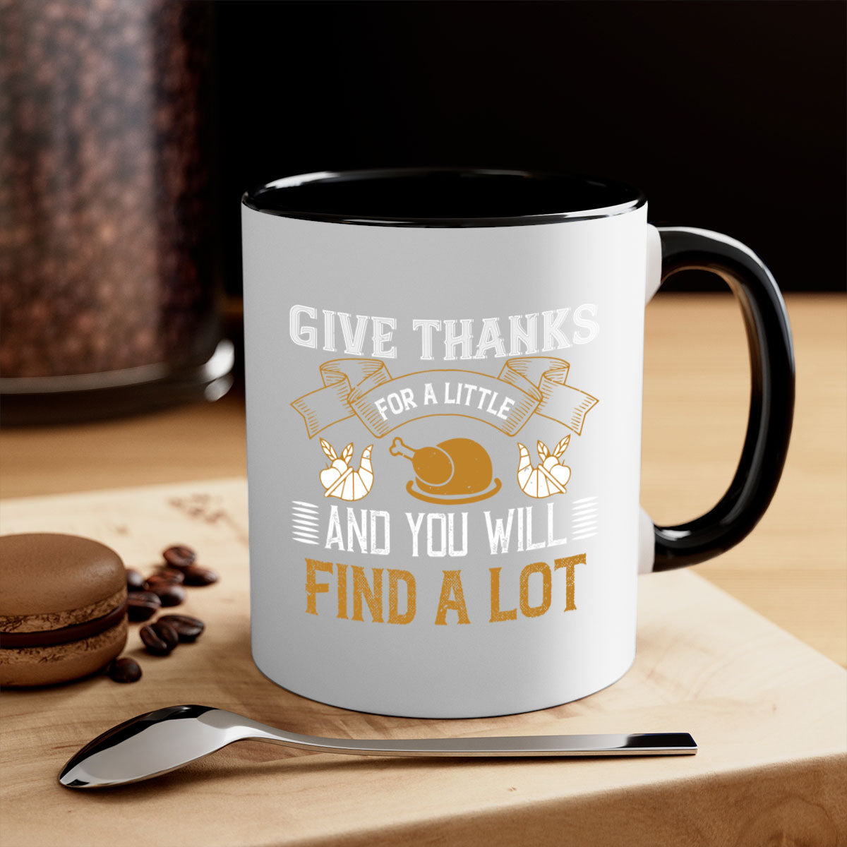 Two-tone ceramic mug with 'Give Thanks for a Little and You Will Find a Lot' design, featuring a colored handle and glossy finish.