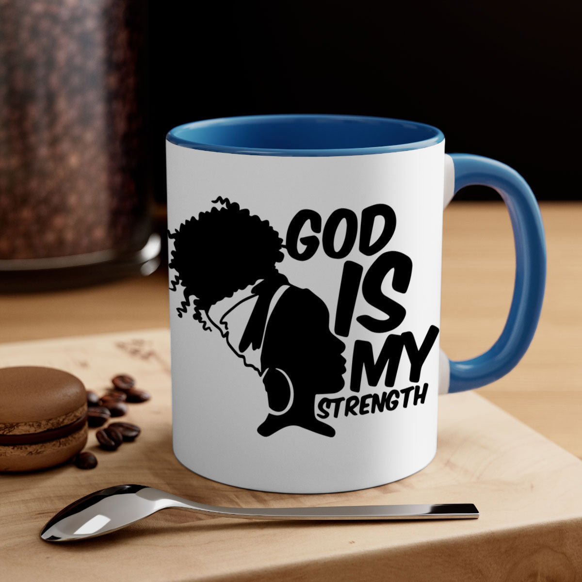 A stylish two-tone ceramic mug with the phrase 'God is My Strength' in black letters, featuring a colored handle and glossy finish.