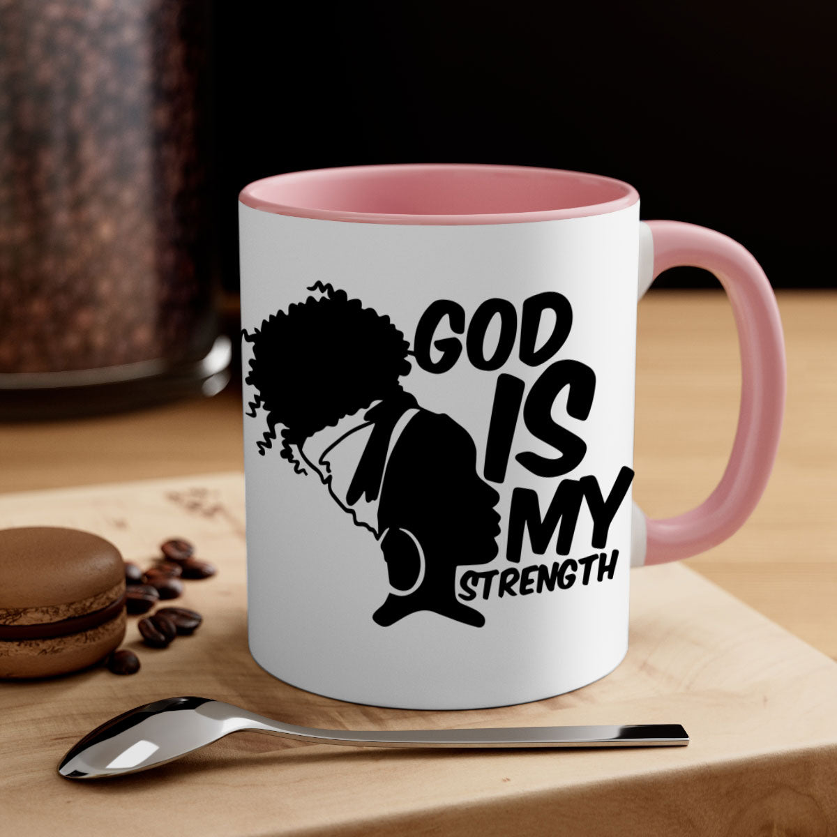 A stylish two-tone ceramic mug with the phrase 'God is My Strength' in black letters, featuring a colored handle and glossy finish.