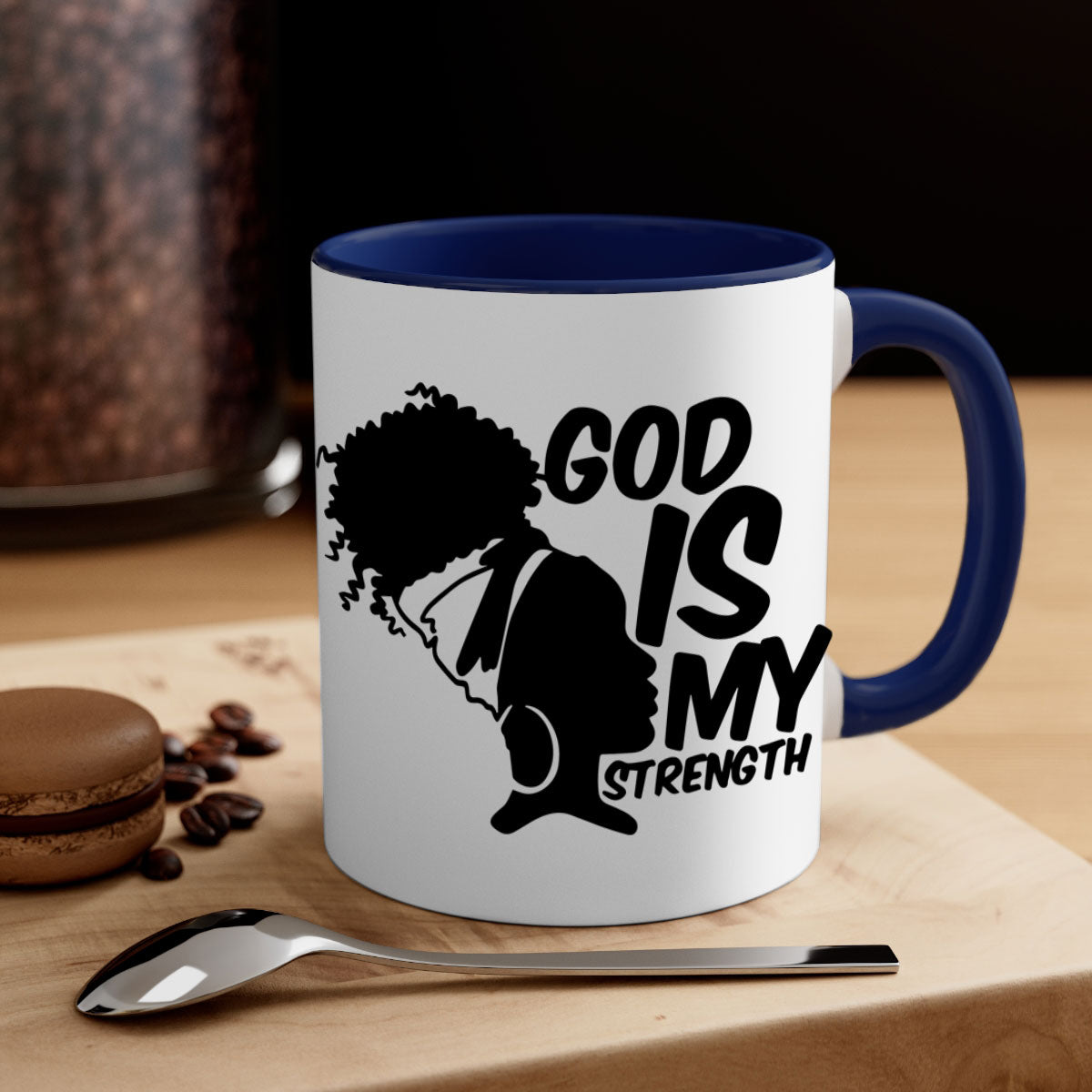 A stylish two-tone ceramic mug with the phrase 'God is My Strength' in black letters, featuring a colored handle and glossy finish.
