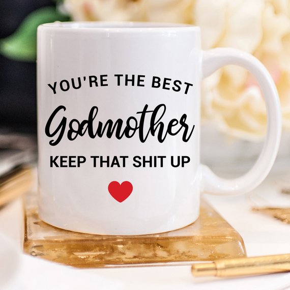 A beautiful white ceramic mug designed for godmothers, featuring a heartfelt message printed on both sides.