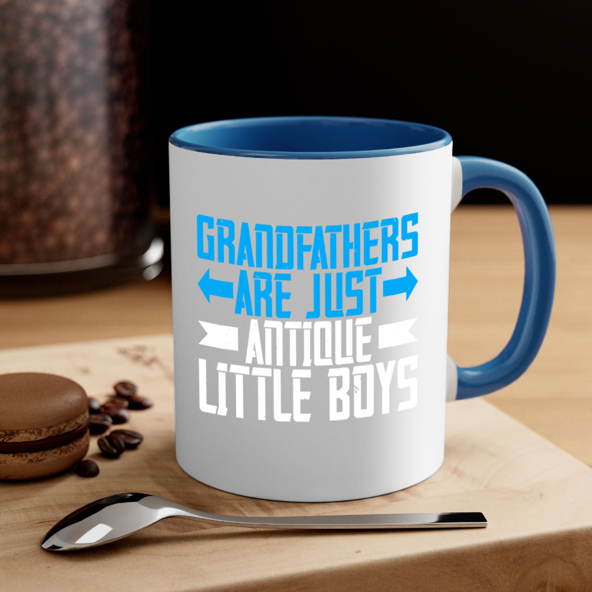 Ceramic coffee mug with humorous design featuring the phrase 'Grandfathers are just antique little boys', available in multiple colors.