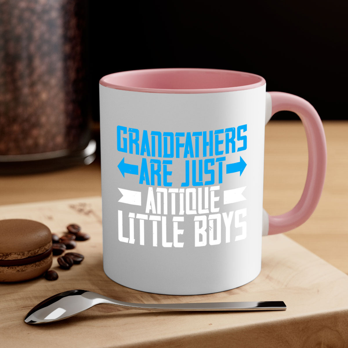 Ceramic coffee mug with humorous design featuring the phrase 'Grandfathers are just antique little boys', available in multiple colors.