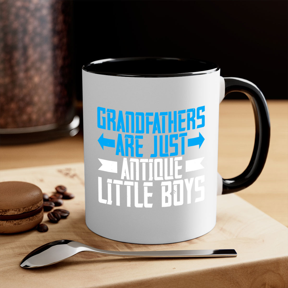 Ceramic coffee mug with humorous design featuring the phrase 'Grandfathers are just antique little boys', available in multiple colors.