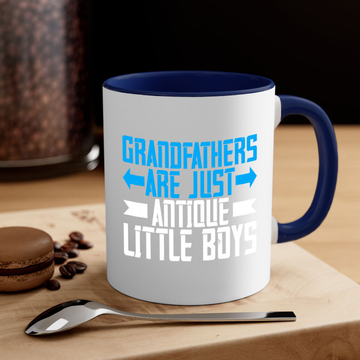 Ceramic coffee mug with humorous design featuring the phrase 'Grandfathers are just antique little boys', available in multiple colors.