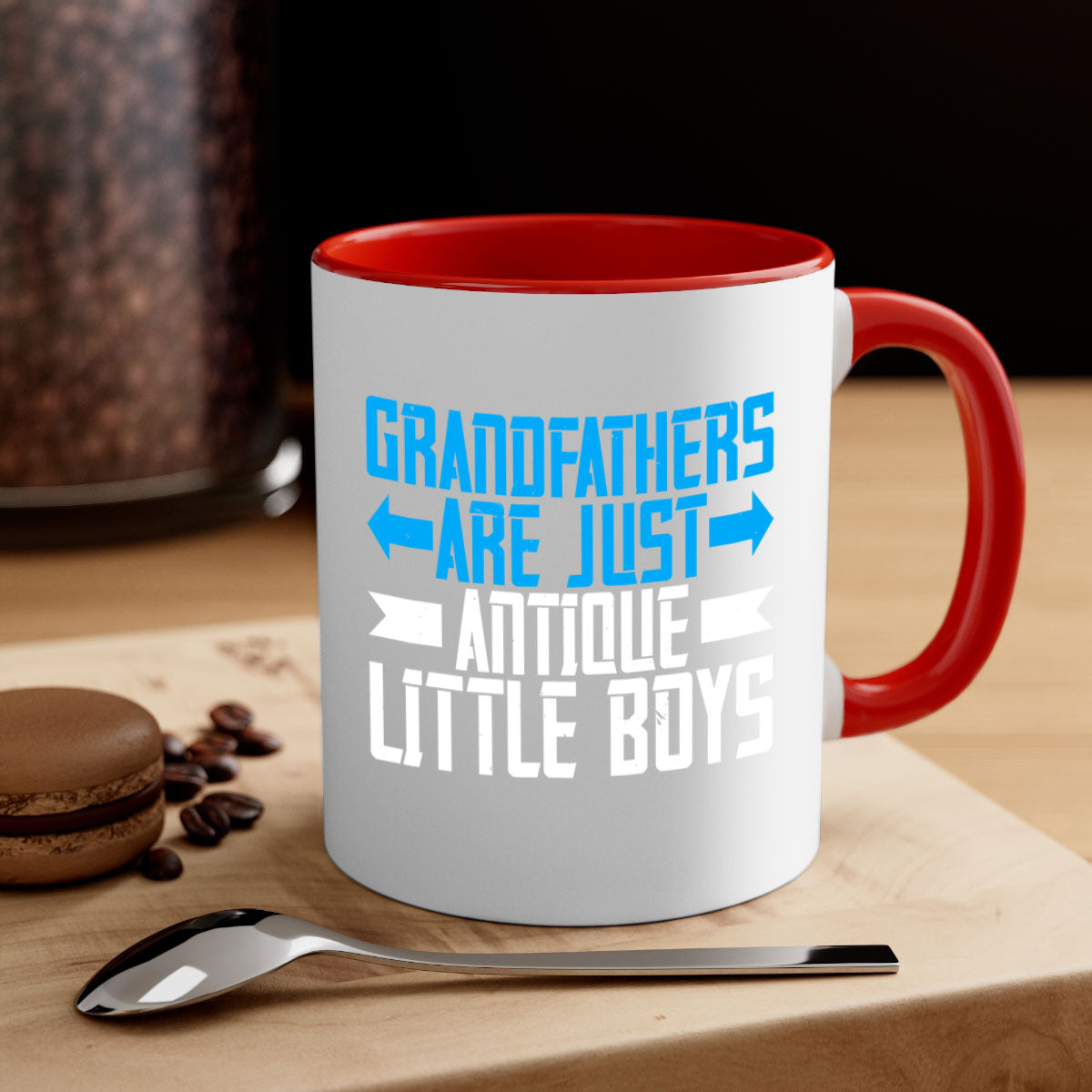 Ceramic coffee mug with humorous design featuring the phrase 'Grandfathers are just antique little boys', available in multiple colors.