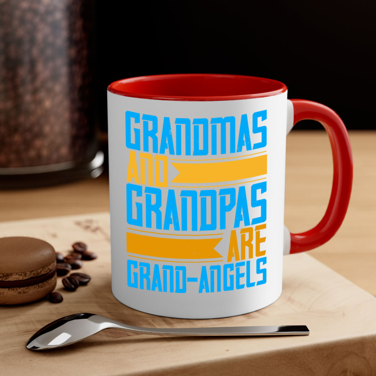 A two-tone ceramic coffee mug with a colored handle and interior, featuring the text 'Grandmas and grandpas are grandangels' in a stylish font.