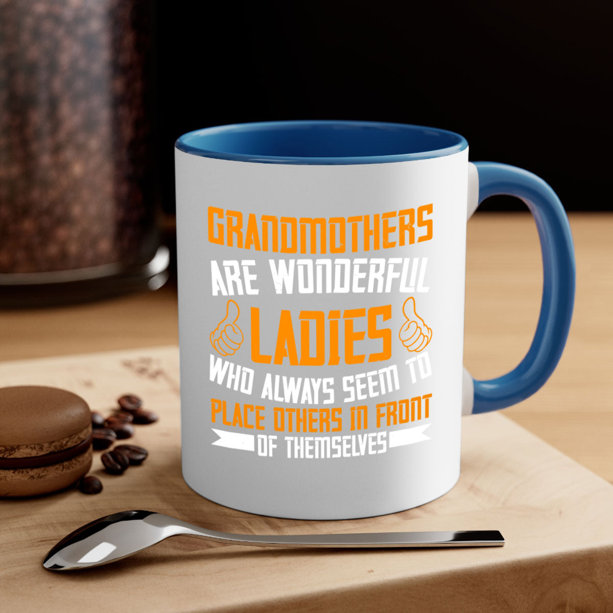 A two-tone ceramic mug with a colored handle and interior, featuring the text 'Grandmothers are wonderful ladies who always seem to place others in front of themselves 78#'.