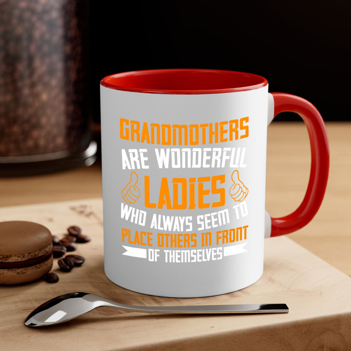 A two-tone ceramic mug with a colored handle and interior, featuring the text 'Grandmothers are wonderful ladies who always seem to place others in front of themselves 78#'.