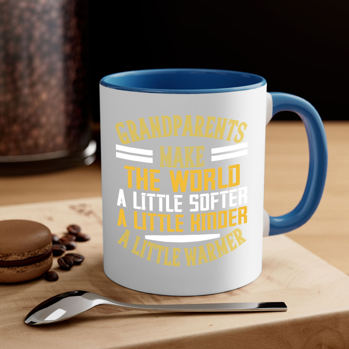 A two-tone ceramic mug with a colored handle and interior, featuring the phrase 'Grandparents make the world … a little softer a little kinder a little warmer' in a stylish font.