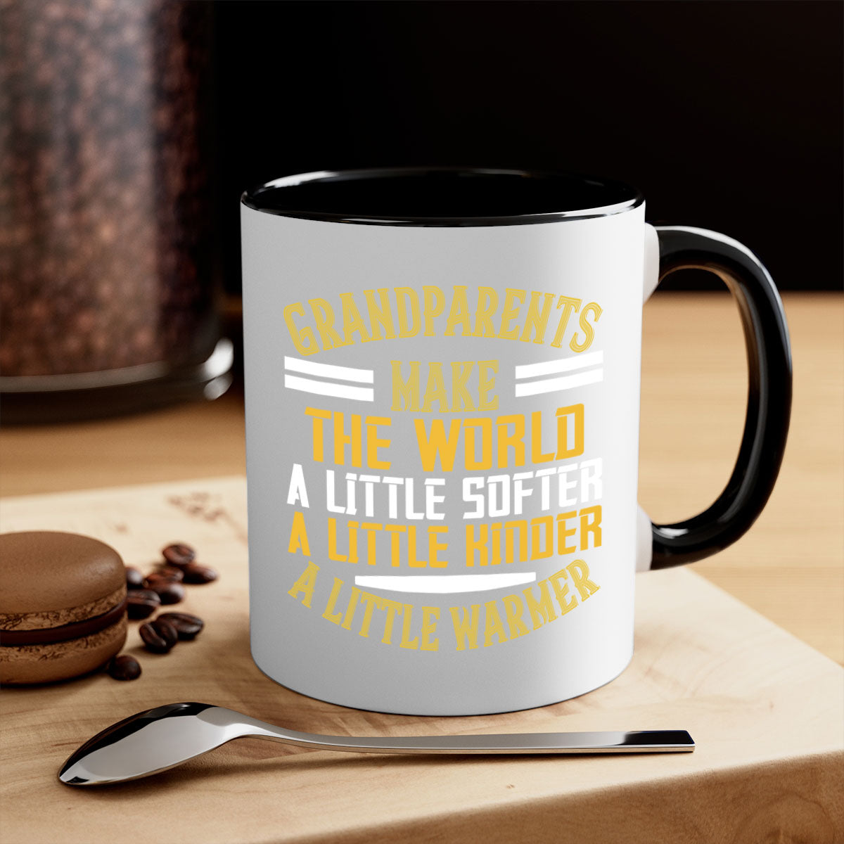 A two-tone ceramic mug with a colored handle and interior, featuring the phrase 'Grandparents make the world … a little softer a little kinder a little warmer' in a stylish font.