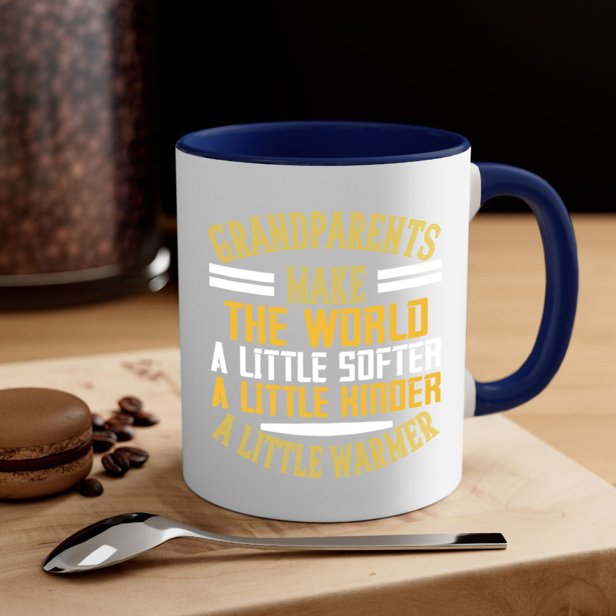 A two-tone ceramic mug with a colored handle and interior, featuring the phrase 'Grandparents make the world … a little softer a little kinder a little warmer' in a stylish font.