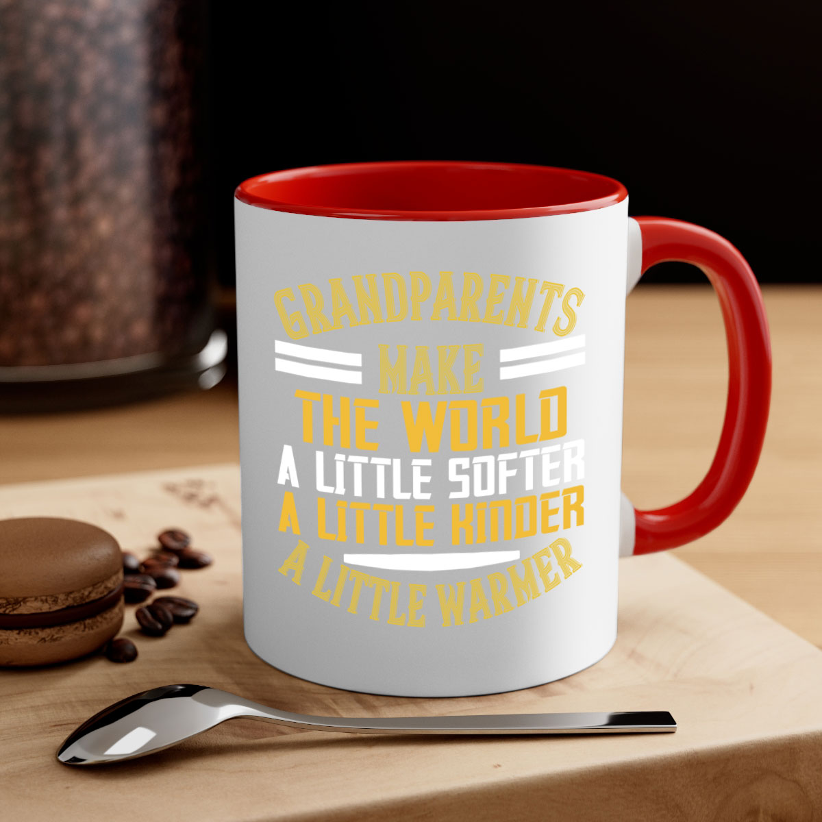 A two-tone ceramic mug with a colored handle and interior, featuring the phrase 'Grandparents make the world … a little softer a little kinder a little warmer' in a stylish font.