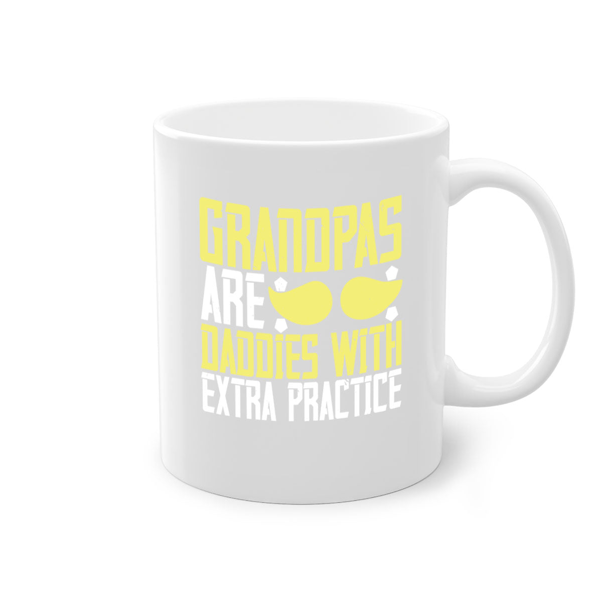 Two-tone ceramic coffee mug with a humorous design saying 'Grandpas are daddies with extra practice', featuring a colored handle and glossy finish.