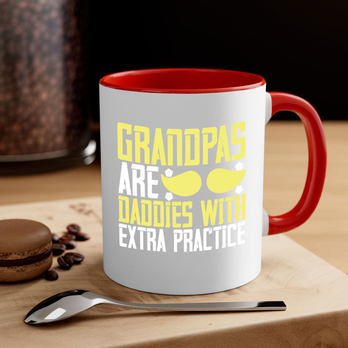 Two-tone ceramic coffee mug with a humorous design saying 'Grandpas are daddies with extra practice', featuring a colored handle and glossy finish.