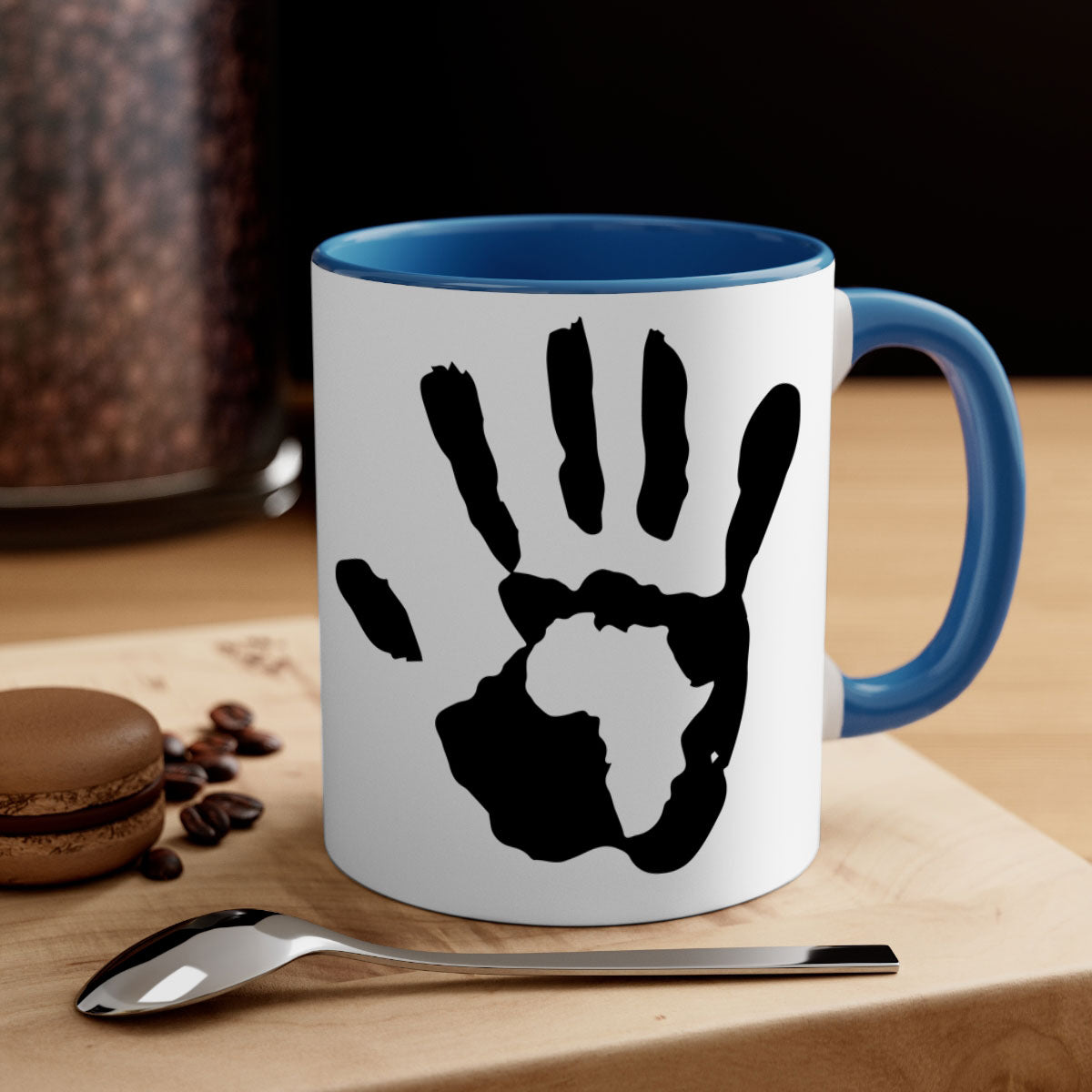 Hand with Africa Mug featuring black words and phrases, available in five colors with a glossy finish and C-shaped handle.