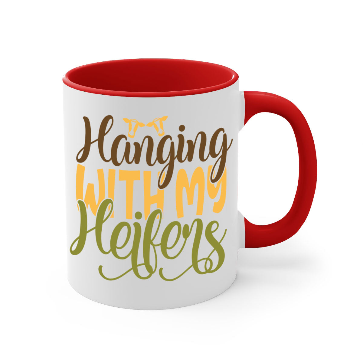 A two-tone ceramic mug with a colorful handle and interior, featuring the phrase 'Hanging with My Heifers' in a glossy finish.