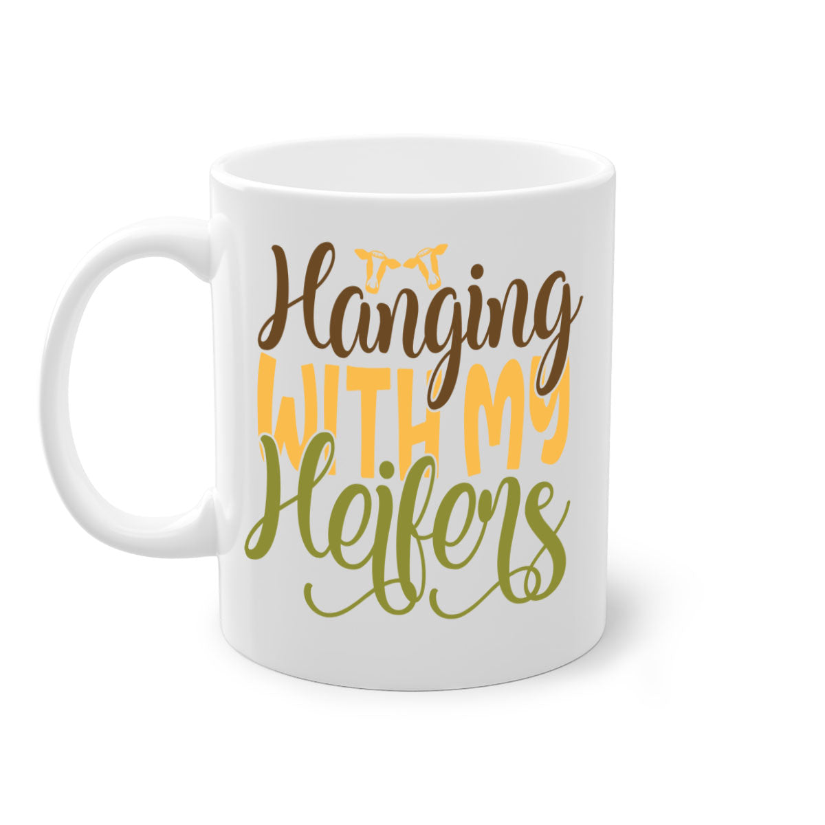 A two-tone ceramic mug with a colorful handle and interior, featuring the phrase 'Hanging with My Heifers' in a glossy finish.