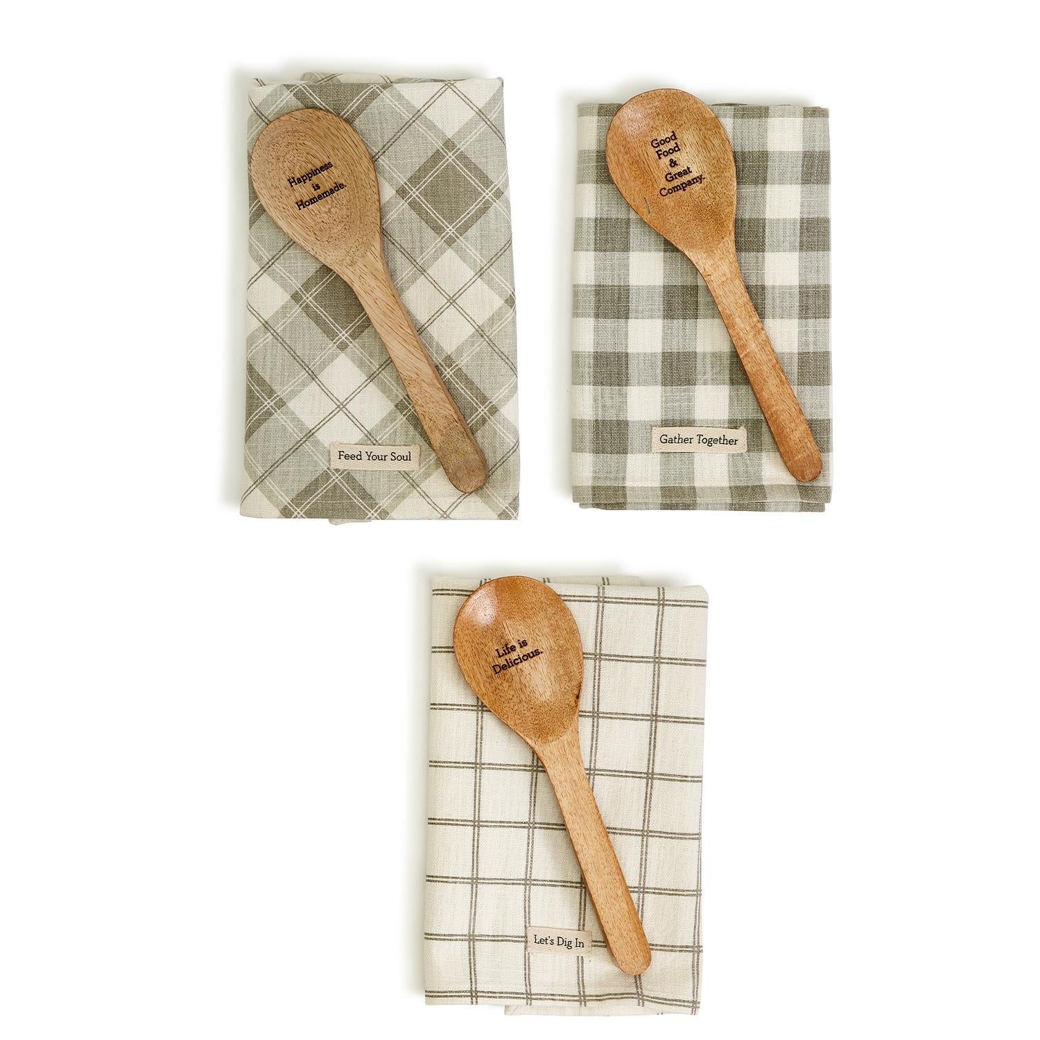 Happiness Is Home Set featuring a decorative dish towel and a wooden spoon with engraved sayings, perfect for gifting.