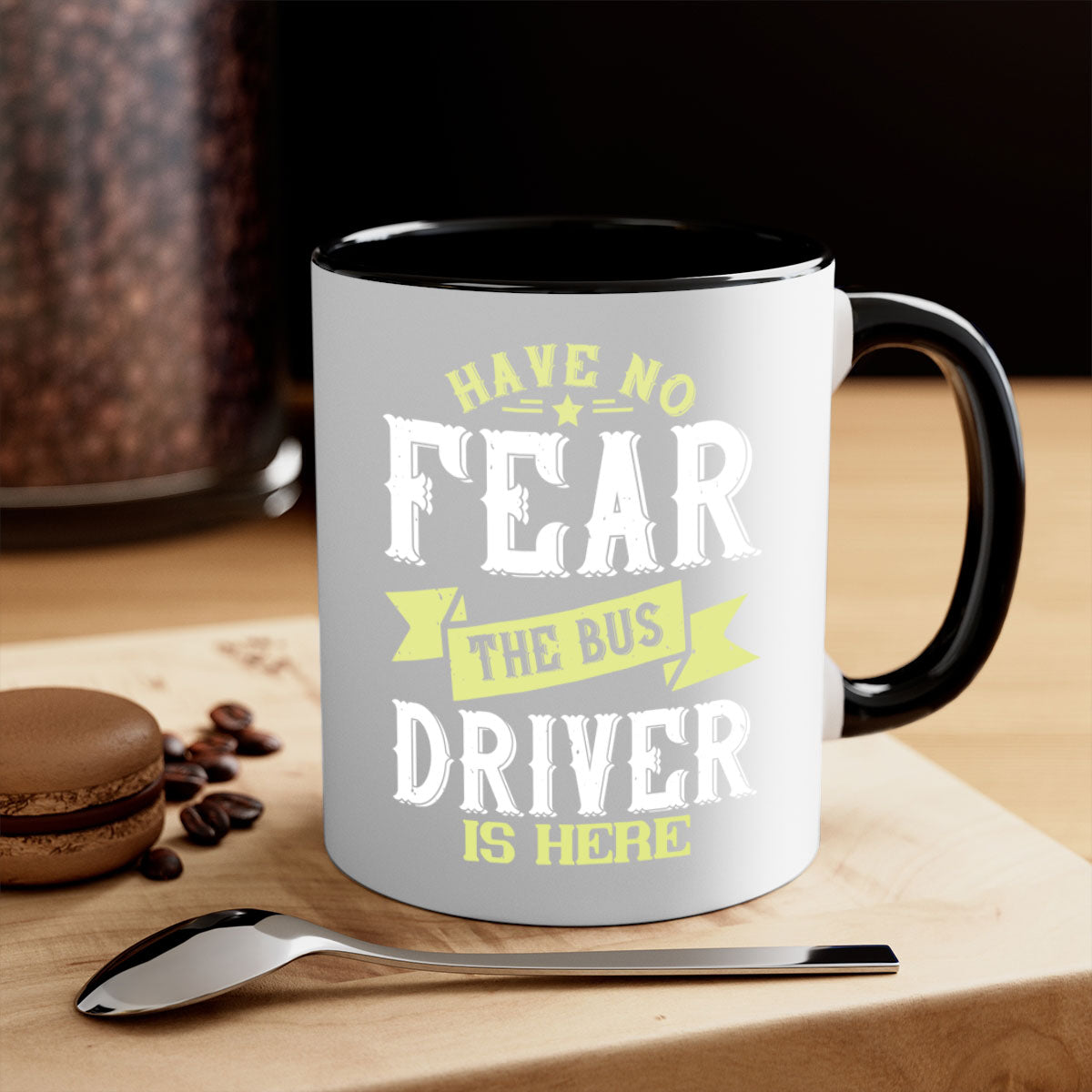 Two-tone ceramic mug featuring 'Have No Fear the Bus Driver is Here' design with colored handle and glossy finish.