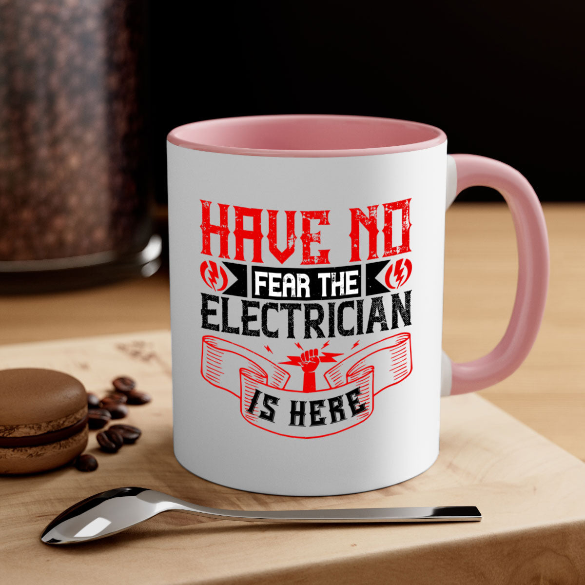 Two-tone ceramic mug with 'Have no fear the electrician is here' design, featuring a colored handle and glossy finish.