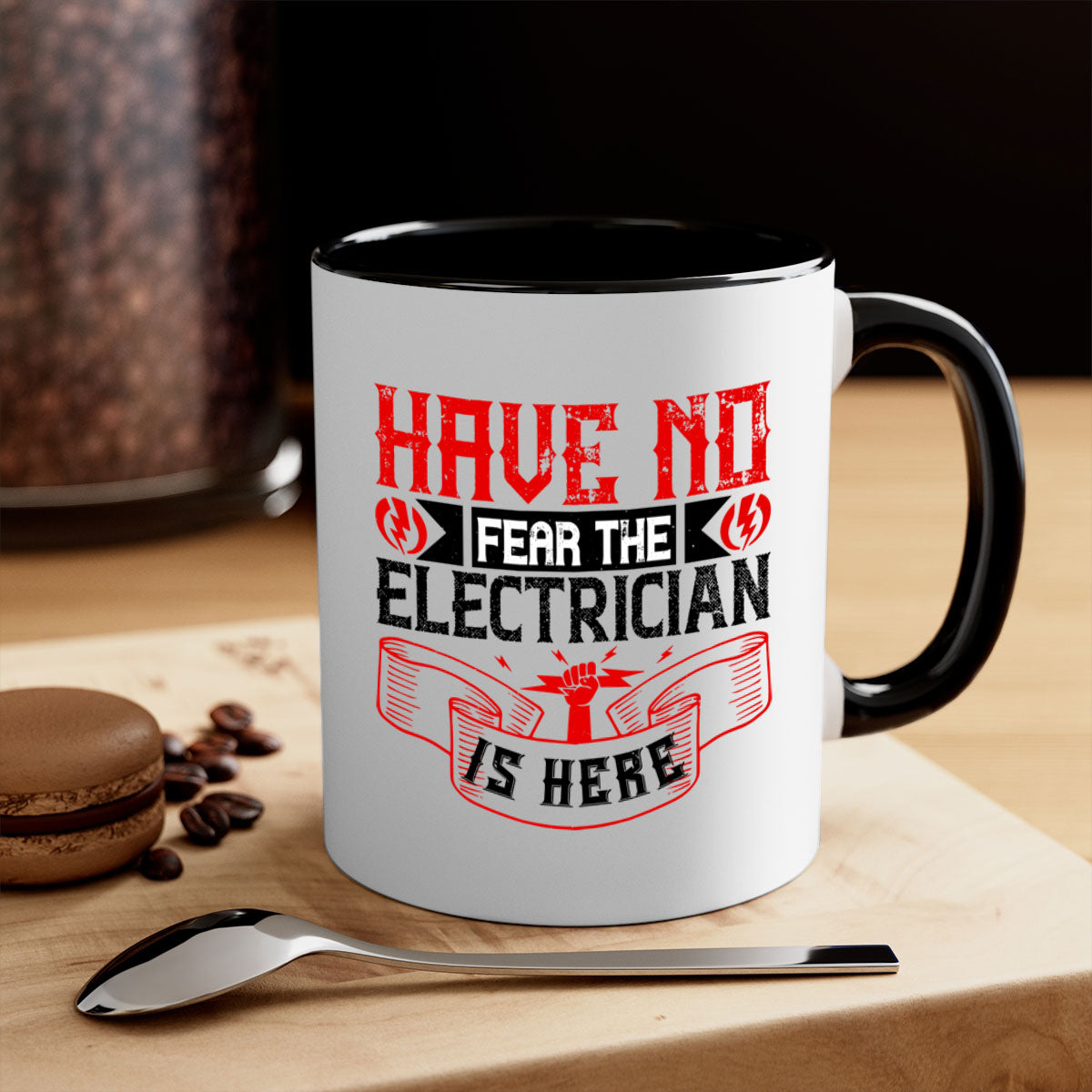 Two-tone ceramic mug with 'Have no fear the electrician is here' design, featuring a colored handle and glossy finish.