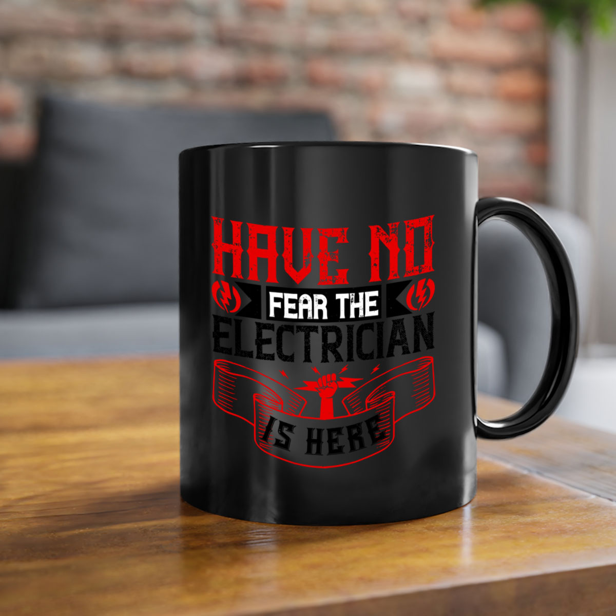 Two-tone ceramic mug with 'Have no fear the electrician is here' design, featuring a colored handle and glossy finish.