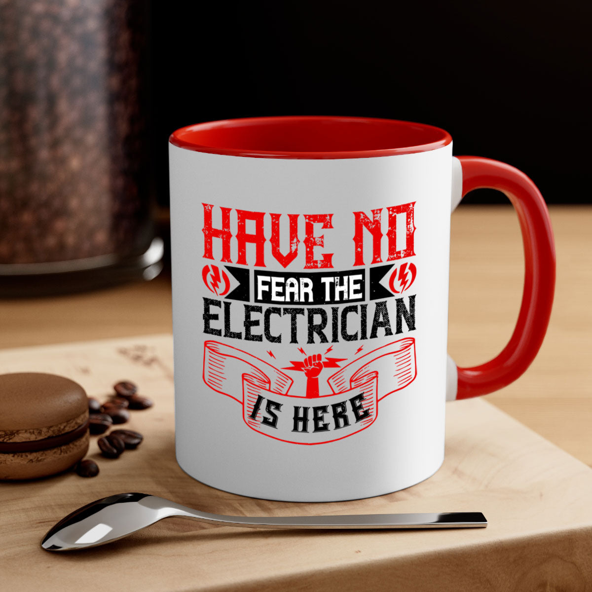 Two-tone ceramic mug with 'Have no fear the electrician is here' design, featuring a colored handle and glossy finish.
