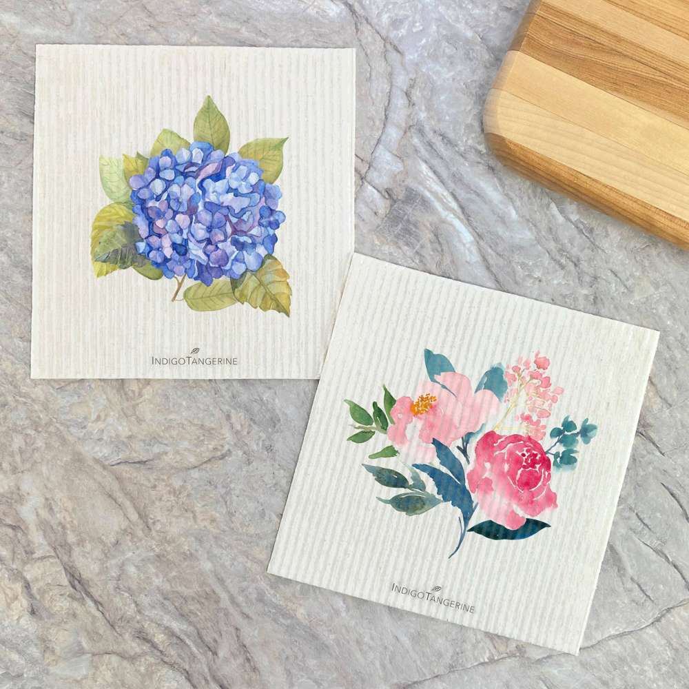 Two Swedish dish cloths featuring beautiful Hydrangea and Peonies designs, made from eco-friendly materials.