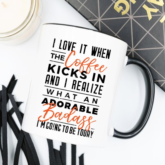 A humorous coffee mug with the phrase 'I Love It When the Coffee Kicks In', showcasing a fun design perfect for coffee lovers.